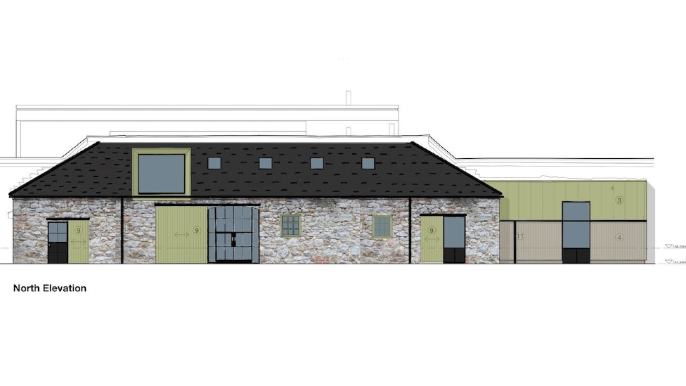 A computer generated image of what the finished bothy will look like. It shows the north elevation of the building, with a long main section and a one-storey extension on the right. The brick looks slightly whitewashed, with big glass windows covered by green sliding barn doors. The roof is covered in dark slate with a large skylight window.