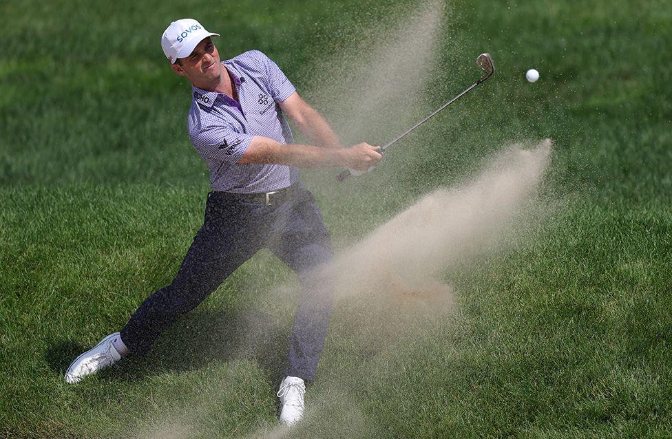 United States' Denny McCarthy plays a shot from a bunker on the sixth hole of the Travelers Championship in Cromwell, Connecticut. Photo by Andrew Redington