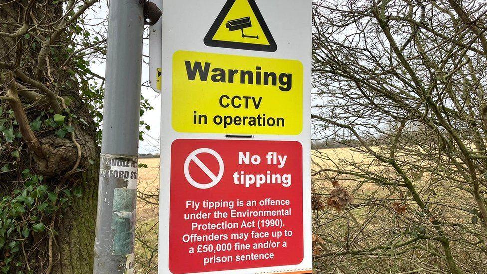 A sign warning against fly-tipping