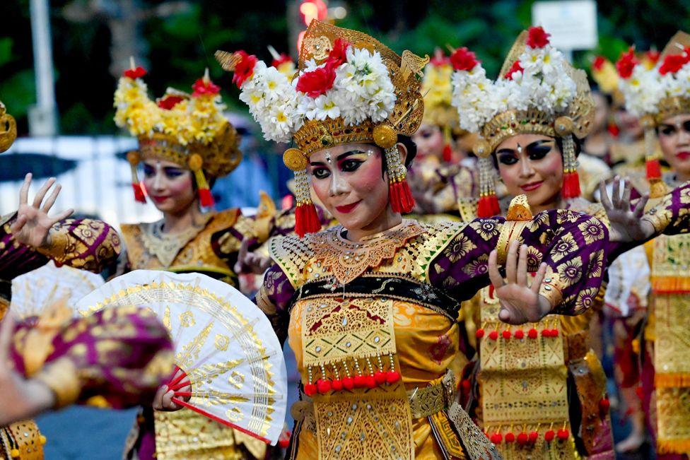 Balinese traditional dancers perform during the dance of releasing the sun 2024, welcoming the sun 2025 a New Year's Eve celebration in Denpasar on Indonesia's resort island of Bali on December 31, 2024.