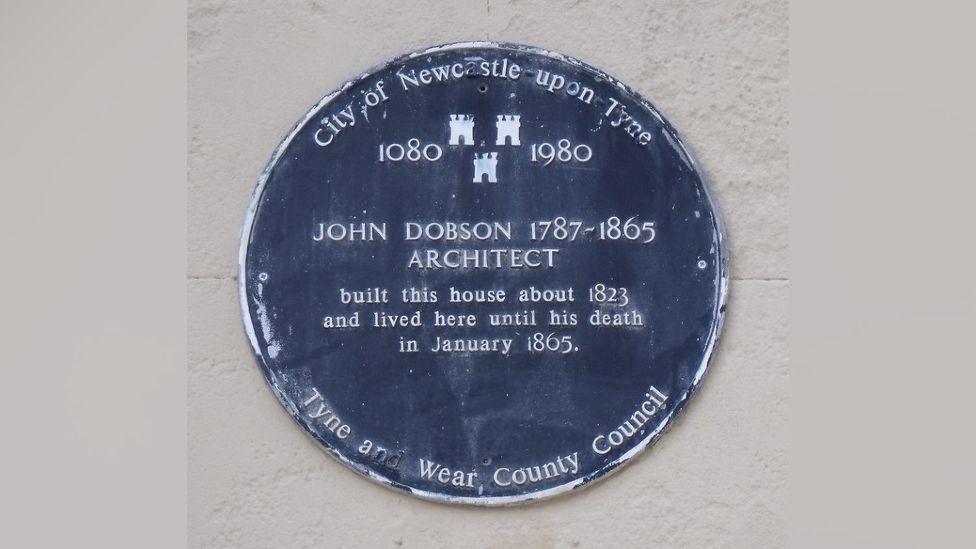 Blue plaque saying John Dobson 1787 - 1865 Architect. It also says he built this house about 1823 and lived here until his death in January 1865