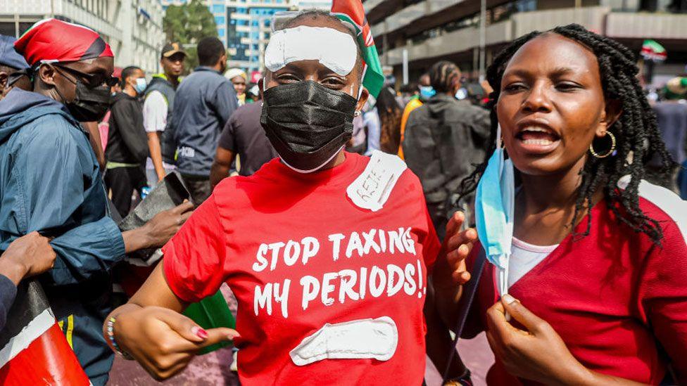 Kenyan protesters in Nairobi, one wearing a T-shirt with the words: "Stop Taxing My Periods!" - Tuesday 25 June 2024