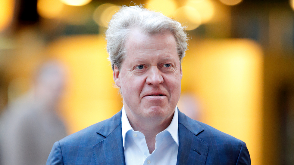 Earl Spencer with light ginger hair wearing a blue jacket