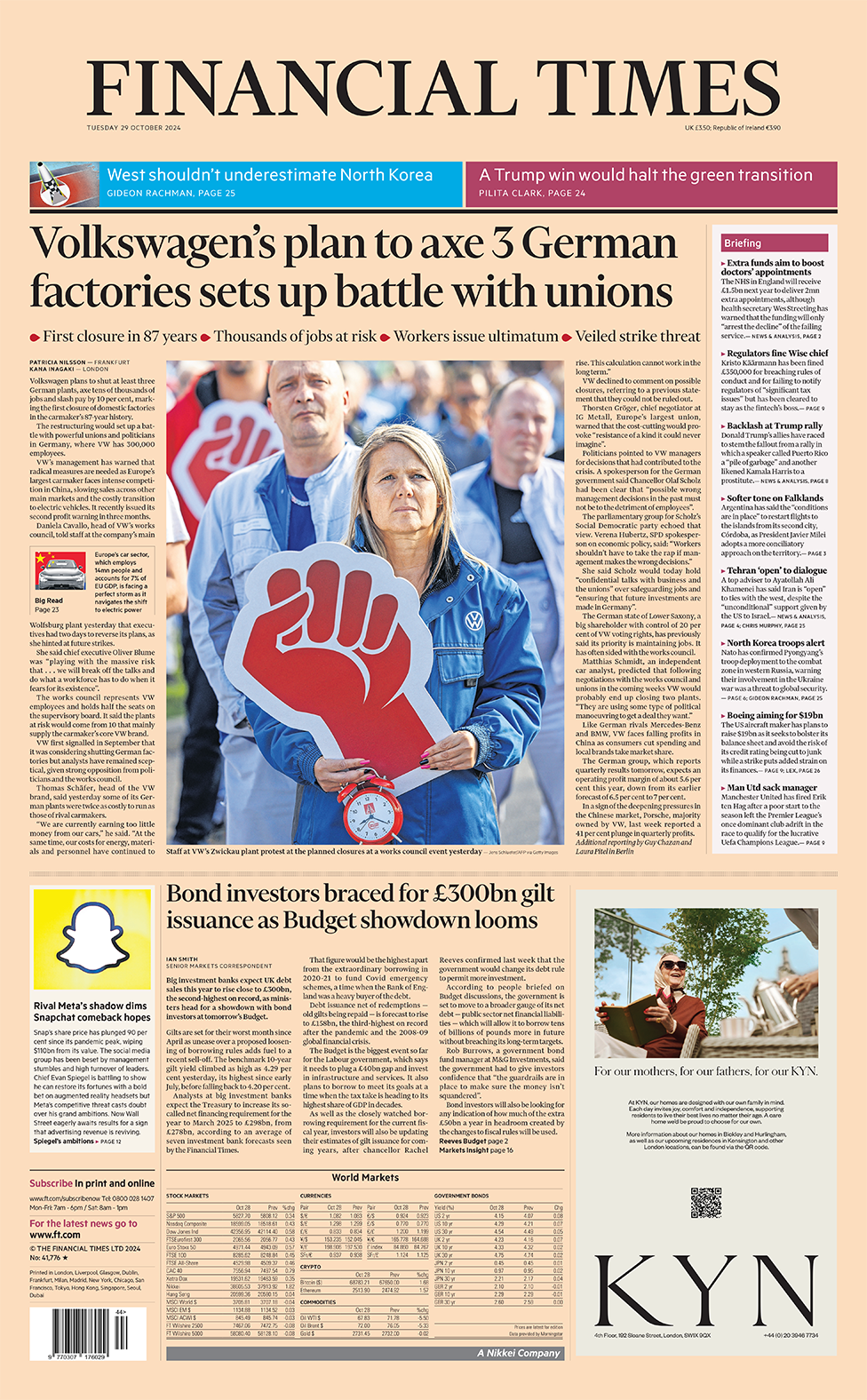 The headline in the Financial Times reads: "Volkswagen's plan to axe 3 German factories sets up battle with unions". 