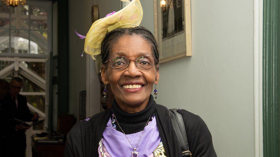 Morcea Walker wearing yellow fascinator