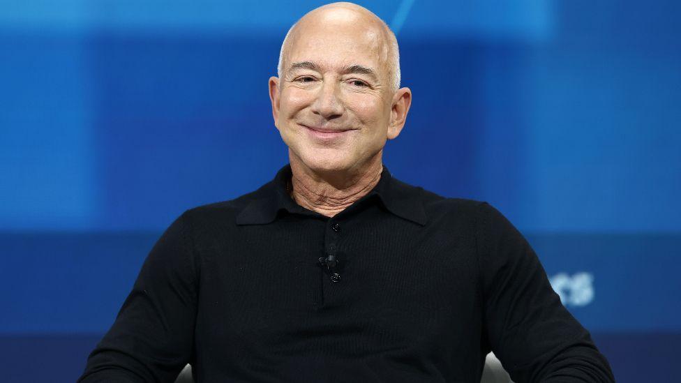 Jeff Bezos, founder and executive chairman of Amazon and owner of the Washington Post, looks out into crowd during the New York Times annual DealBook summit at Jazz at Lincoln Center on December 04, 2024 in New York City