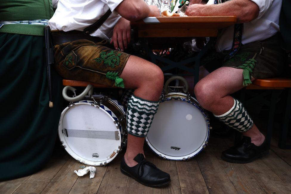 Musicians in traditional costumes gather in a tent after a parade during the 189th edition of the Oktoberfest beer and amusement festival in the Bavarian state capital Munich, Germany, 22 September 2024.