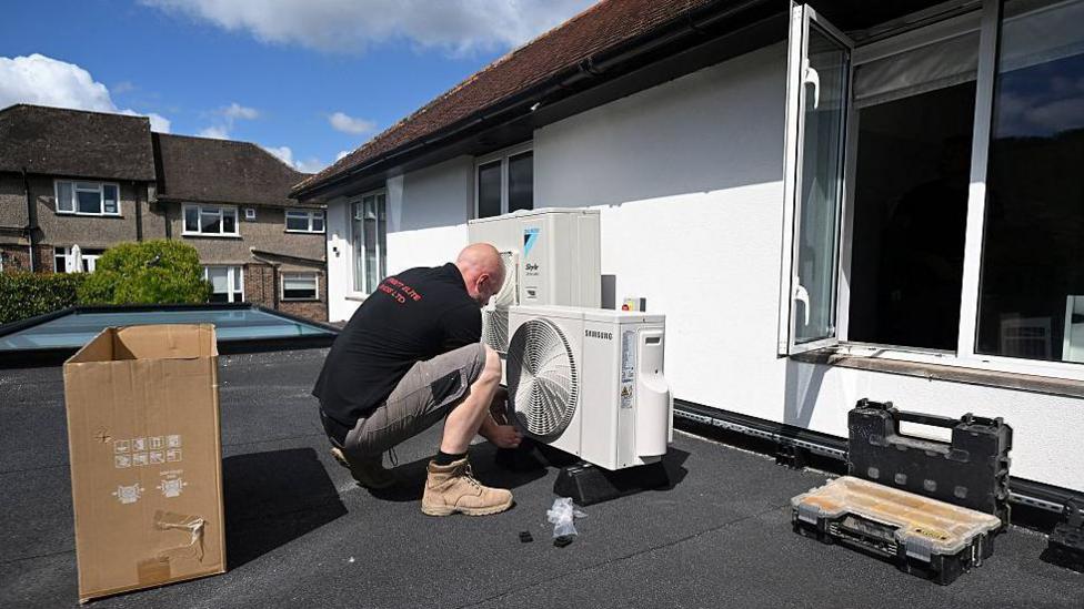 Fit schools, hospitals and new homes with air con, say Lib Dems