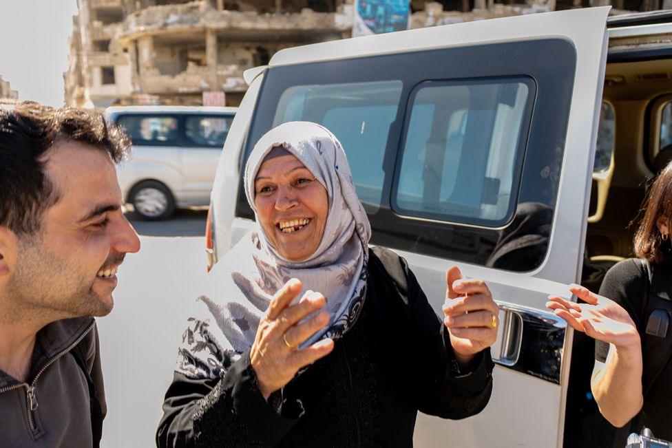 Fatima Hazzouri stands outside a mini-van