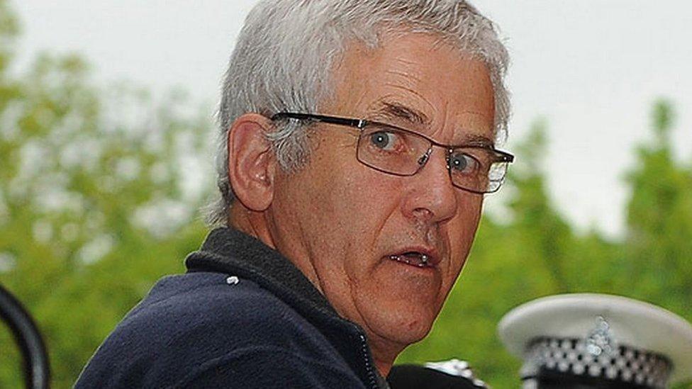 John Cooper as he is led into court for his murder trial at Swansea Crown Court.