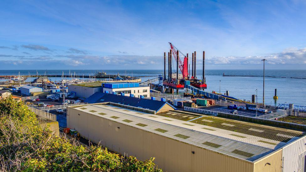 Ariel view of Port of Ramsgate. There is blue skies and machinery in the distance. 