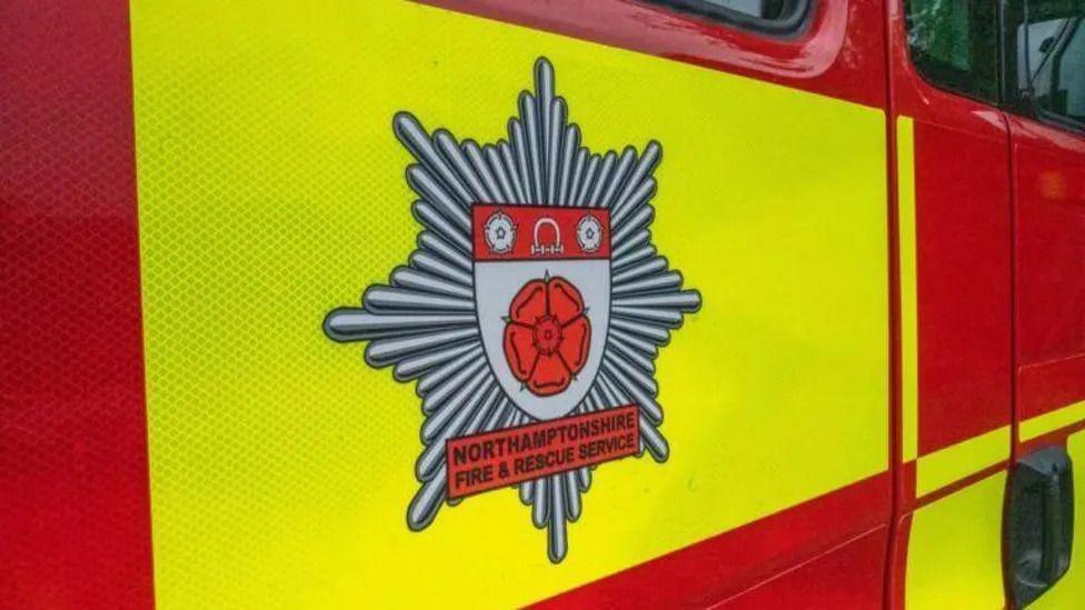 Northants fire service logo on a fire engine.