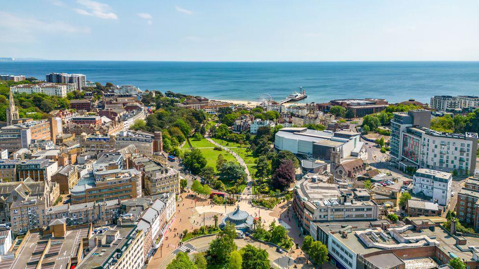 Sunny aerial view of Bournemouth town centre looking across the Lower Gardens towards the sea