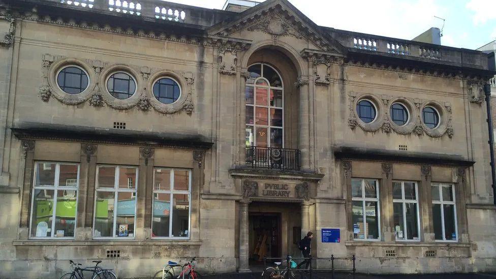 A man leaving Hove Library