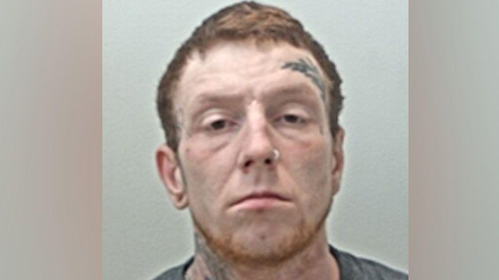 A police mugshot of Daniel Hardcastle