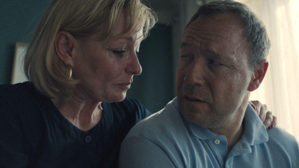 Christine Tremarco with an arm around Stephen Graham, both looking tearful