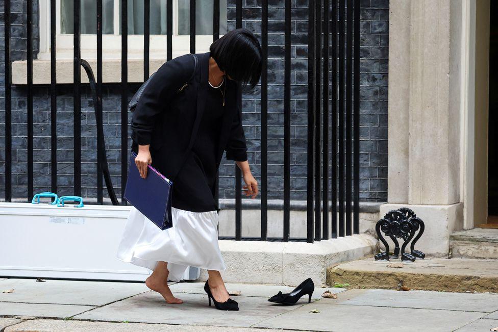 Britain's Lord Chancellor and Secretary of State for Justice, Shabana Mahmood, goes to retrieve her shoe after losing it from her foot, outside 10 Downing Street, in London, Britain, September 9, 2024.