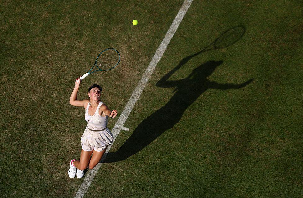 Magdalena Frech serves against Diana Shnaider during the Women's Singles First Round match at The Queen's Club in London. Photo by Dan Istitene
