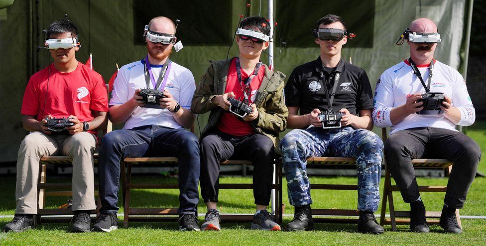 Competitors fly their racing drones during a Military International Drone Tournament at Honourable Artillery Company in London on September 17, 2024. 