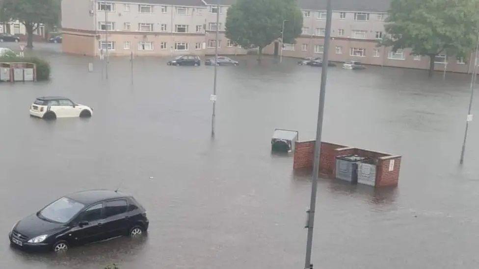 Submerged car park viewed from a flat window in August 2022