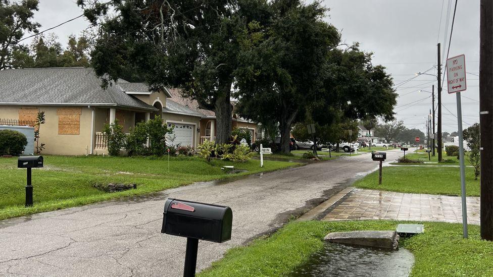 Rainwater starts to pool on a Florida street at Hurricane Milton approaches