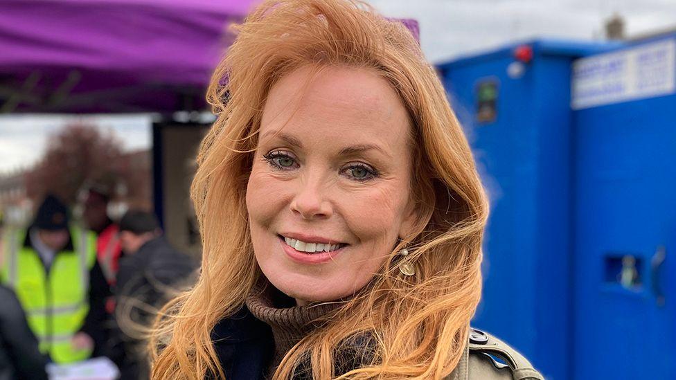 Head and shoulders image of Gabby Blackman. She is smiling and has long strawberry-blonde hair