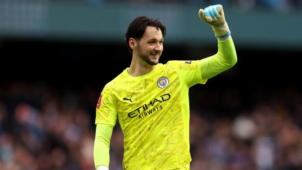 James Trafford with his fist in the air in celebration