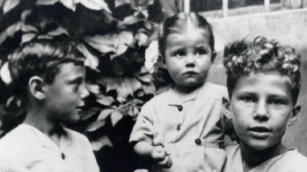 Giorgio Armani (left) with childhood friends during World War II in Italy