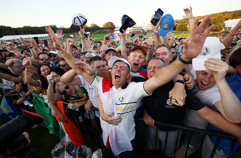 Rory McIlroy celebrates with fans after Europe's 15-13 win over America during the trophy presentation of the 2025 Ryder Cup in Farmingdale, New York. Photo by Maddie Meyer