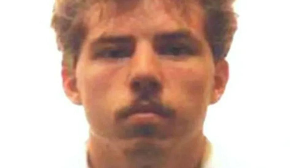 An old mugshot showing William 'Billy' Dunlop, who killed Julie Hogg in 1989. In the photo, Dunlop who has blonde medium-length hair and a full moustache, stares at the camera with no facial expression.
