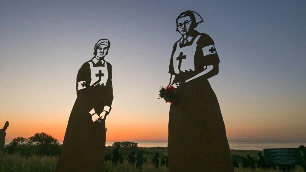 Silhouettes of the two nurses who were part of a D-Day installation at Normandy