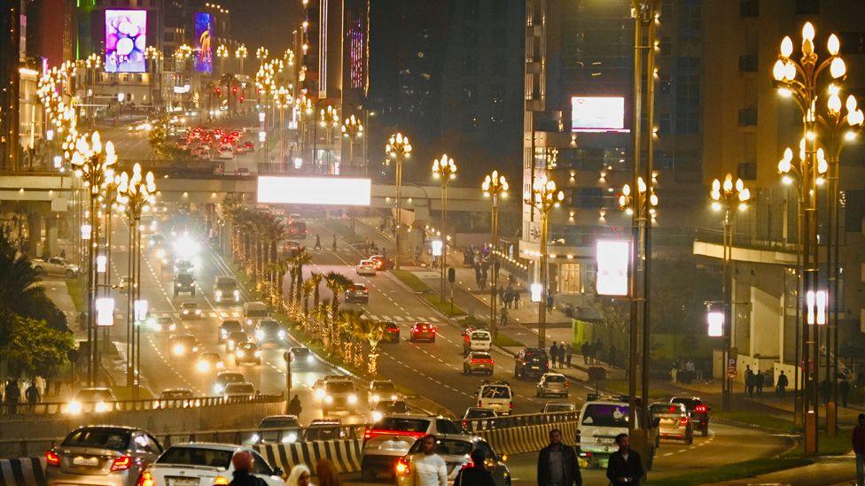 Traffic on a dual carriageway pictured at night in Addis Ababa. Posters and adverts featuring New Year messages can be seen. Ethiopia - Wednesday 10 September 2025.