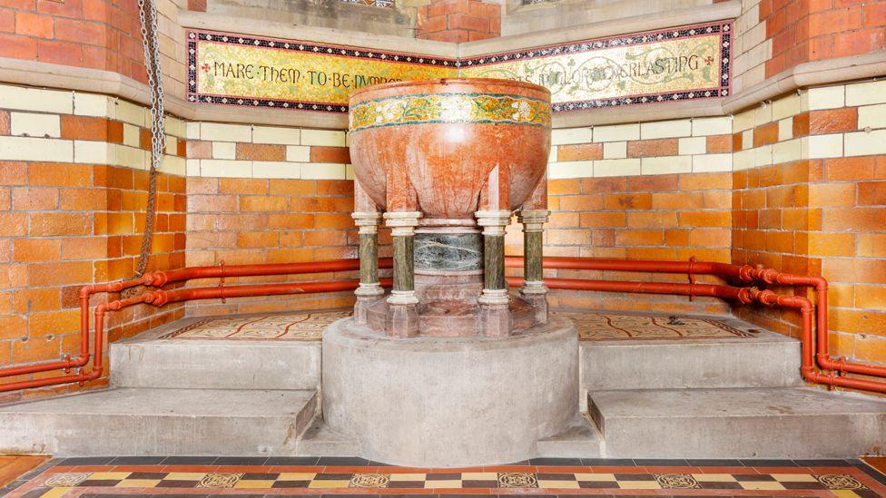 Church of St Anne, St Anne's Drive, Haughton, Denton, Greater Manchester.   Interior, detail of restored font and flooring