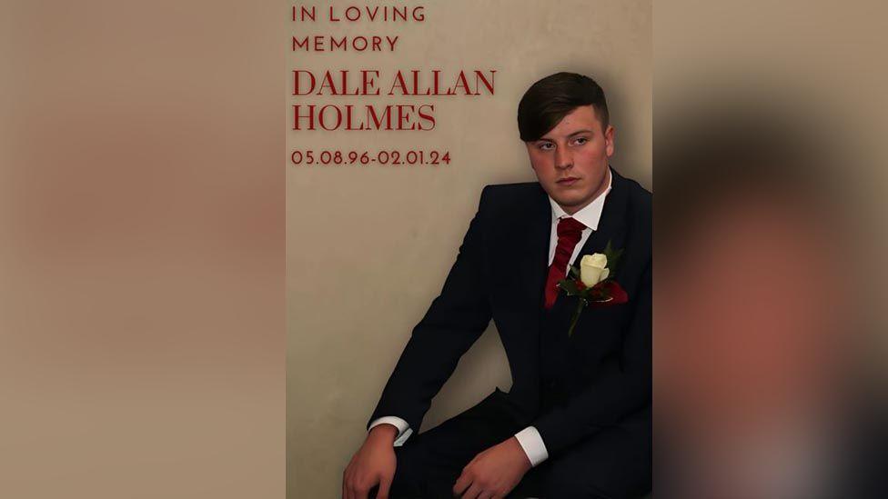 "In loving memory of Dale Allan Holmes. 05.08.96 - 09.01.24' written in red next to a picture of Mr Holmes 