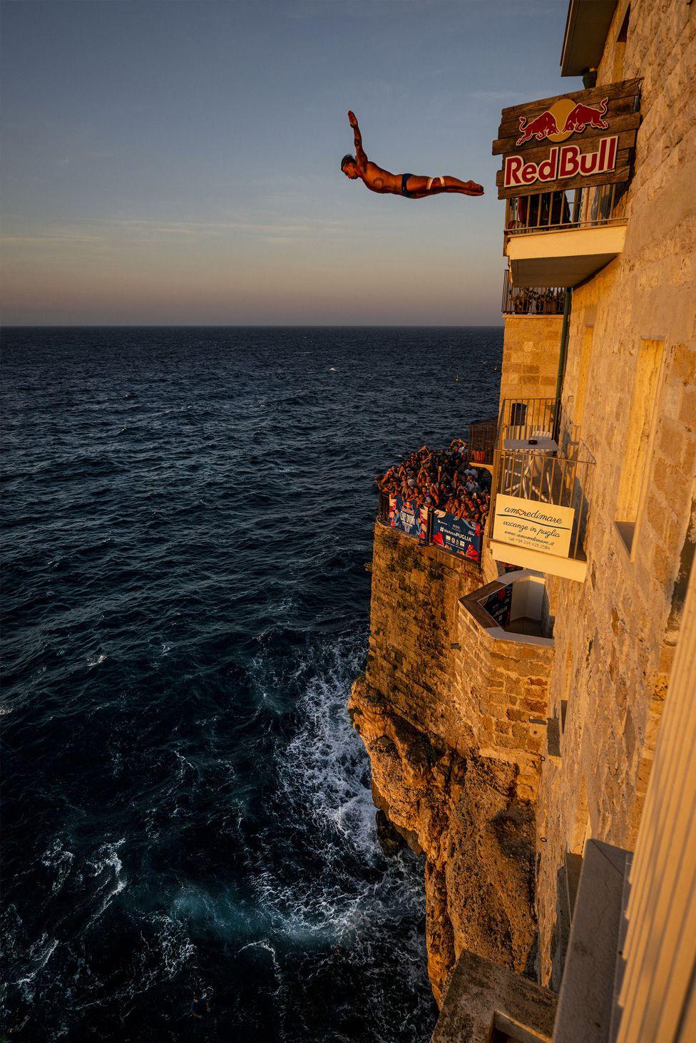 Nikita Fedotov of Armenia dives from the 26 metre balcony during the first day of the second stop of the Red Bull Cliff Diving World Series in Polignano a Mare, Italy. Photo by Dean Treml