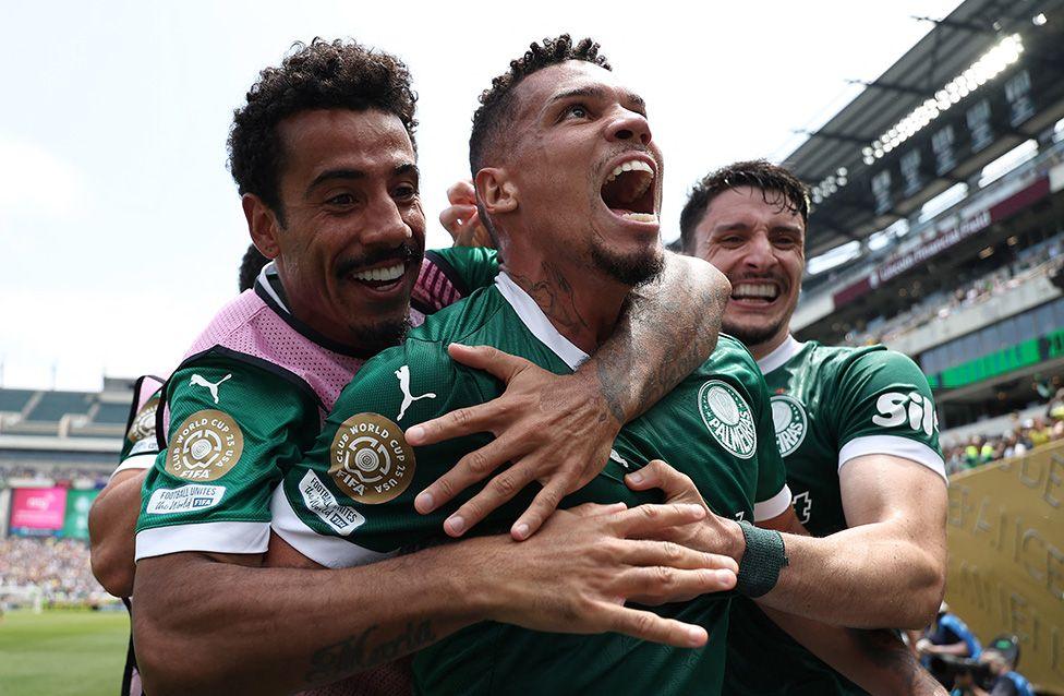 Palmeiras' Brazilian forward Paulinho celebrates with teammates after scoring the opening goal during the match between Palmeiras and Botafogo in Philadelphia. Photo by Franck Fife