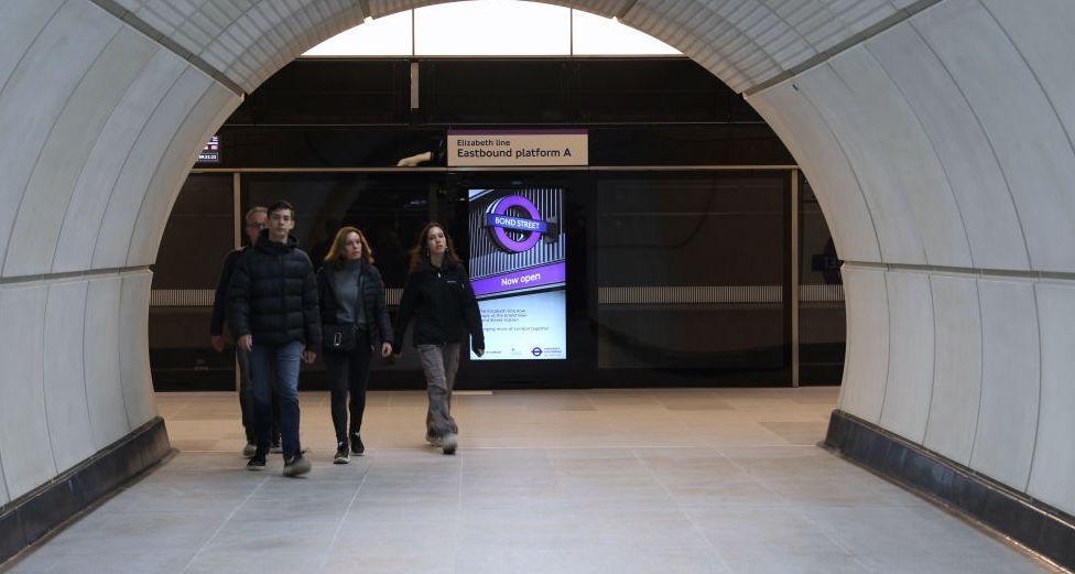 A picture of people at an Elizabeth line station