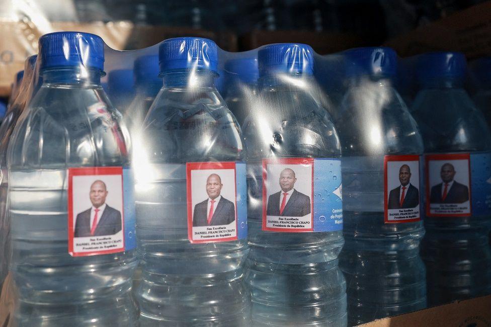 A general view of water bottles with stickers on of Mozambique President-elect Daniel Chapo.