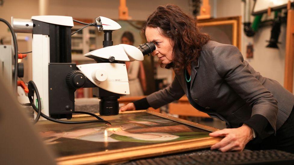 Professor Aviva Burnstock examines a painting for evidence it is by Scottish 18th century artist, Katherine Read.