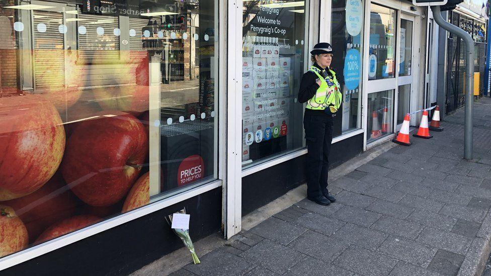 Outside the Co-op in Penygraig after the attack