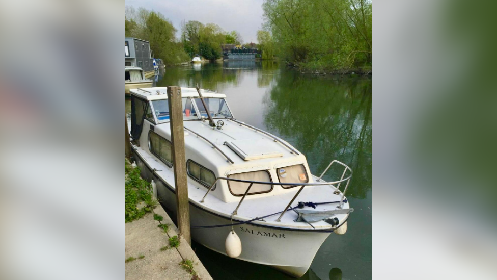 A Freeman boat, called Salamar, moored on the River Thames in calmer waters 