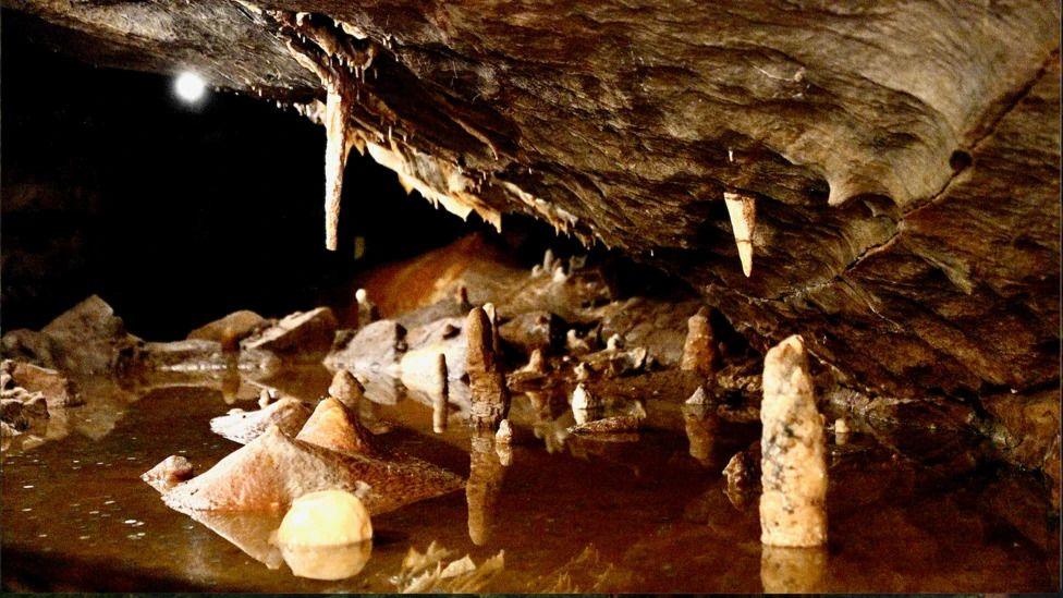 a cave with lots of stalagmites and stalagmites