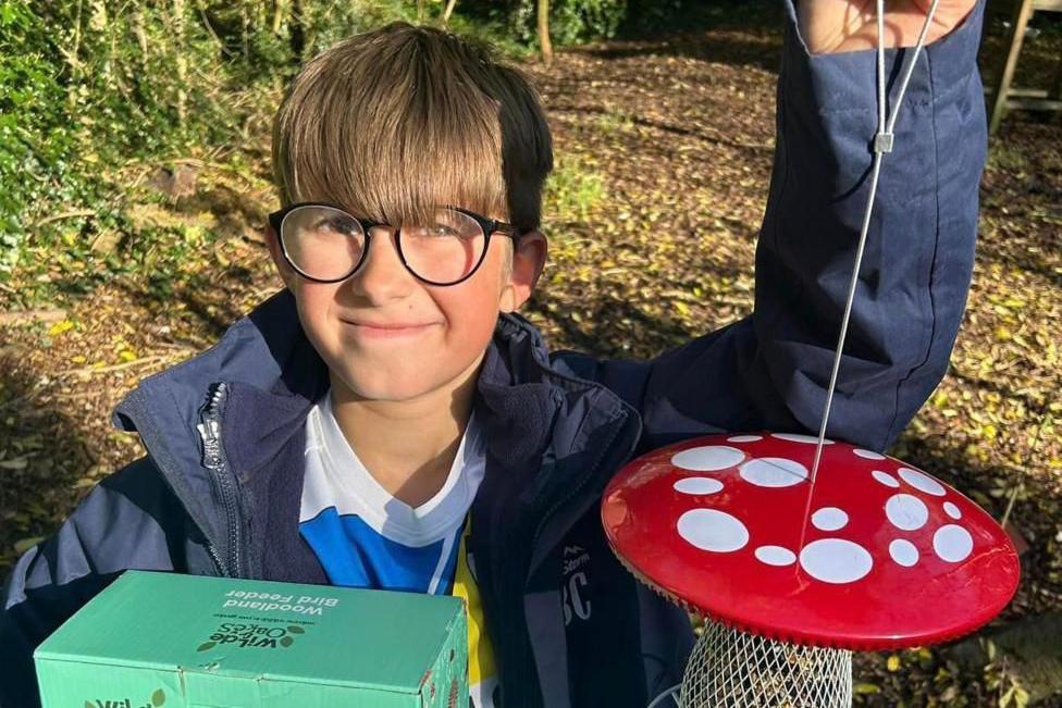 Brody and some of the bird boxes he has helped fundraise for