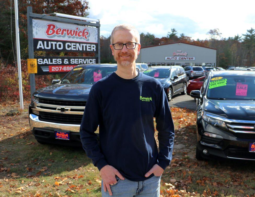 Jeremy stood in front of cars