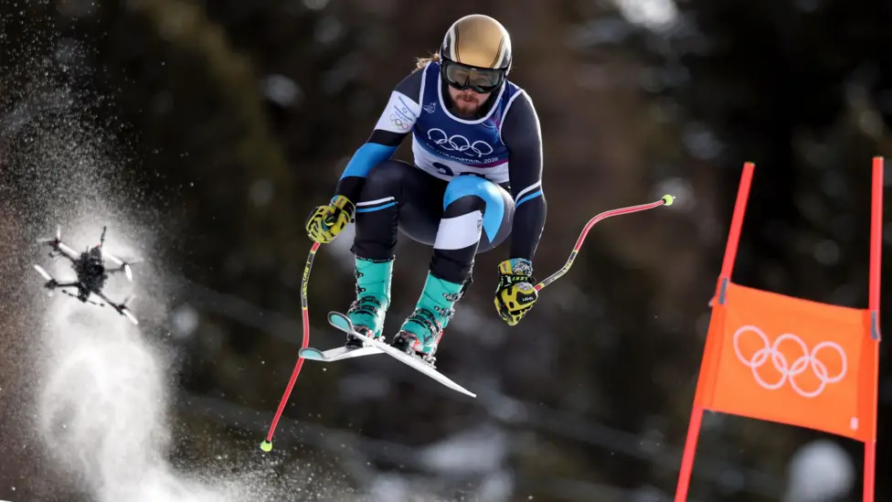 A drone follows Israel's Barnabas Szollos during the men's downhill at the Winter Olympics