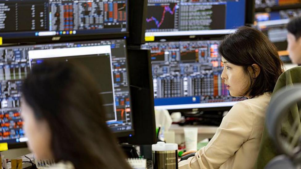 A stock trading screen showing tech stocks falling sharply in Asian markets