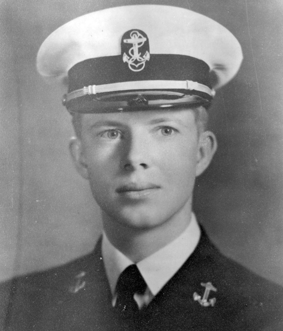 A picture of Carter in Navy military uniform