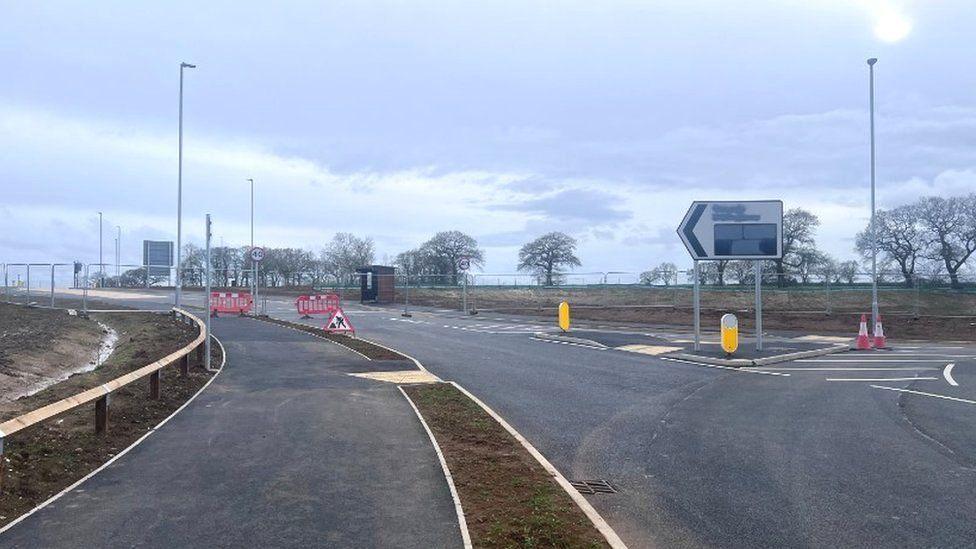 Newly built road with barriers visible