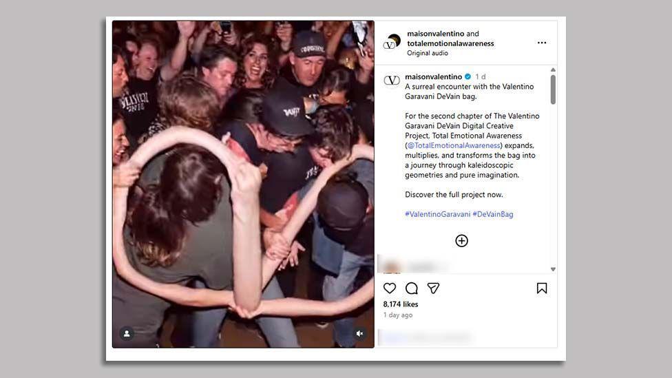 A screenshot of @maisonvalentino's post on Instagram of its AI-generated video advert shows a crowd of people with long, curved arms twisted to resemble the Valentino Garavani logo, besides a text caption.