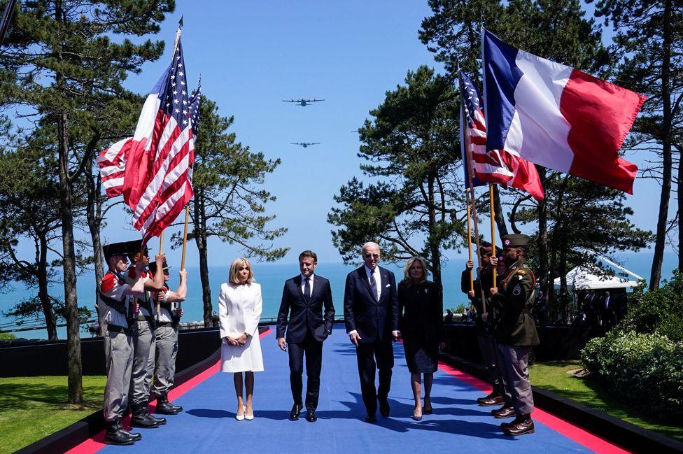 U.S President Joe Biden, first lady Jill Biden, French President Emmanuel Macron and his wife Brigitte Macron attend a ceremony to mark the 80th anniversary of D-Day at the Normandy American Cemetery and Memorial in Colleville-sur-Mer, France, June 6, 2024. 